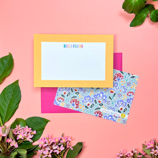 Cute yellow pebble spotted frame greeting card set of 10. Say "HELLO FRIEND" in a rainbow macaroon pastel way. Silver blue paisley pattern printed on back. Shown with a magenta envelope.