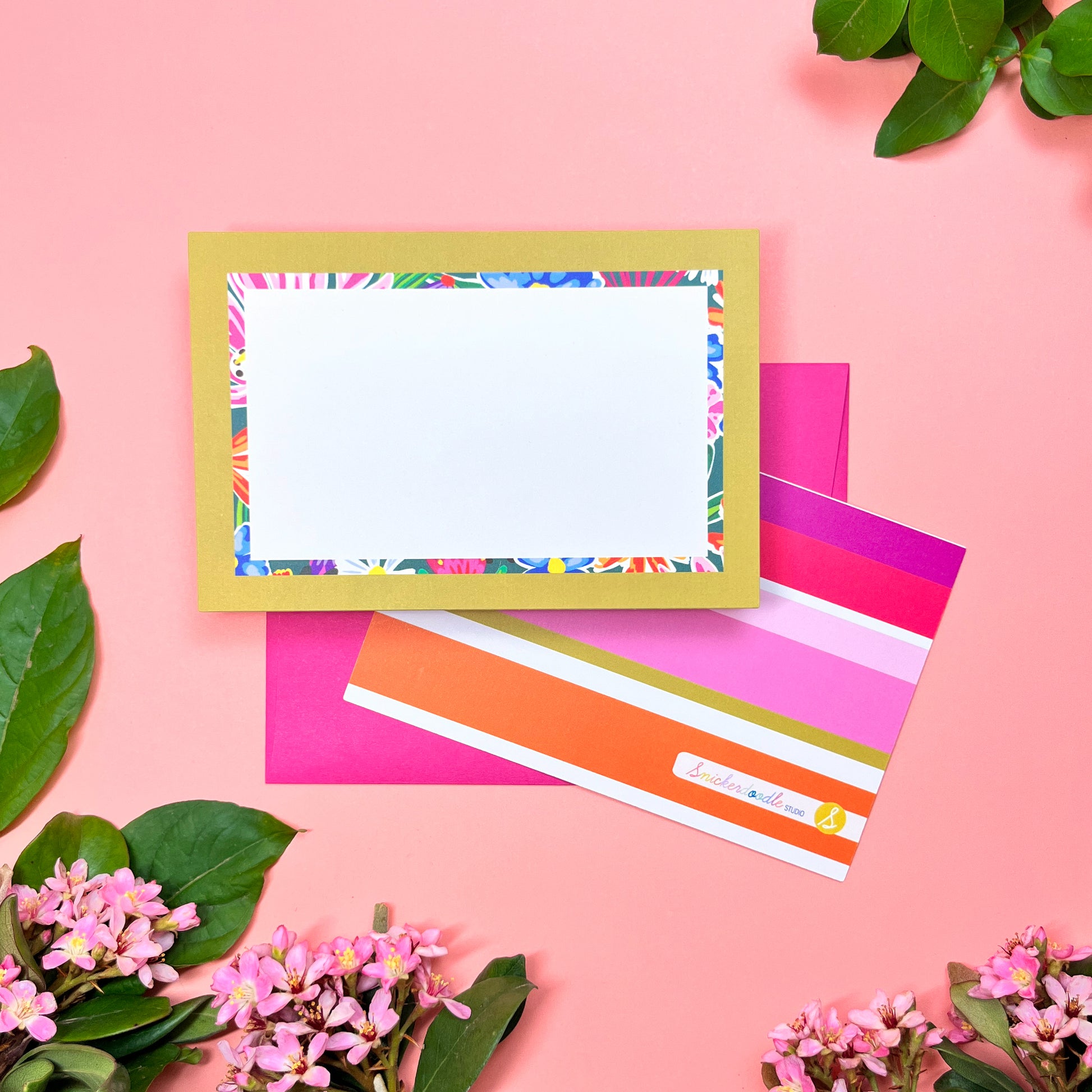 Bright floral pattern in a retro olive- lime border flat note card with a bright stripped back. Perfect for a warm and fu way to send a correspondence.Shown on a magenta envelope.