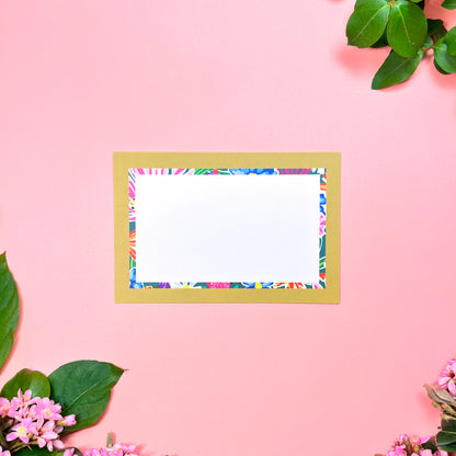 Bright floral pattern in a retro olive- lime border flat note card with a bright stripped back. Front of card shown by itself.
