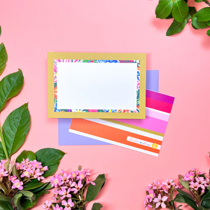 Bright floral pattern in a retro olive- lime border flat note card with a bright stripped back. Perfect for a warm and fu way to send a correspondence.Shown on a lilac envelope.
