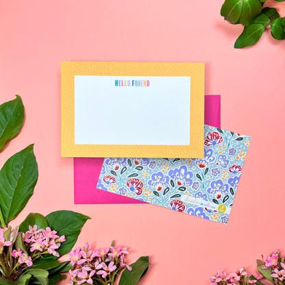 Cute yellow pebble spotted frame greeting card set of 10. Say "HELLO FRIEND" in a rainbow macaroon pastel way. Silver blue paisley pattern printed on back. Shown with a  magenta envelope.