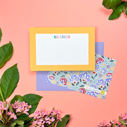 Cute yellow pebble spotted frame greeting card set of 10. Say "HELLO FRIEND" in a rainbow macaroon pastel way. Silver blue paisley pattern printed on back. Shown with a  lilac envelope.