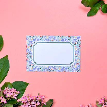 Mahjong inspired flat note set of 10 for greeting cards. Features silver blue paisley pattern with a bamboo hinted frame for a warm handwritten letter. Front of card shown by itself.