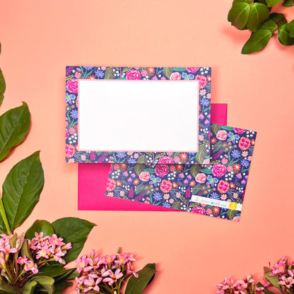 The Summer Night Floral pattern shows beautifully calm, but bright florals on a deep navy background with a bright blue butterfly. This Stationery set of 10  is perfect for a gentle greeting that still expresses the joy of hope. Shown front and back of card on a magenta envelope.